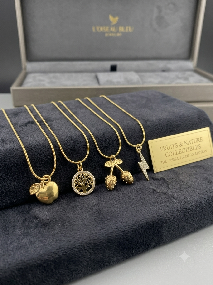 Gold snake chain with golden apple pendant on display bust