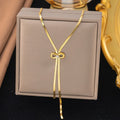 Gold Herringbone Bow Lariat Necklace with Crystal
